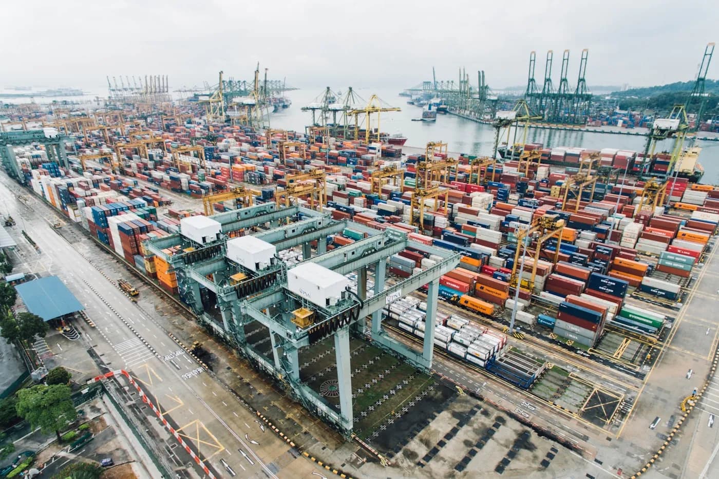 Container terminal with cranes and shipping containers at an international port